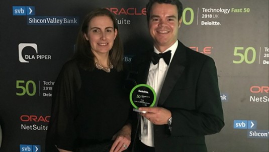 Roger Beadle and Megan Neale of Limitless picking up our Deloitte Technology Fast 50 trophy.